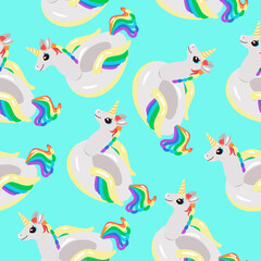 Seamless pattern of rainbow unicorns on a blue background.Vector pattern can be used in children's textiles,banners, postcards,packages.