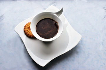 black coffee in a decorative white cup