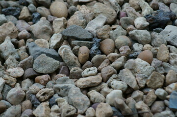 River stones on the river bank. Background image.