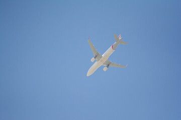 Airplane in the sky. Passenger plane on blue sky