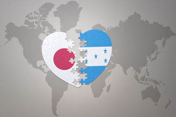 puzzle heart with the national flag of japan and honduras on a world map background. Concept. 3D illustration