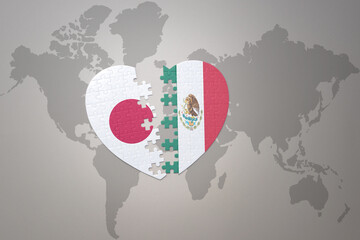 puzzle heart with the national flag of japan and mexico on a world map background. Concept. 3D illustration