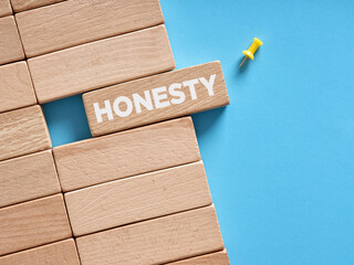 The word honesty written on wooden blocks. Trust, ethics or integrity in business