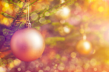 Fototapeta premium Christmas celebration holiday background - christmas-tree decoration bauble on decorated Christmas tree with defocused blurred lights bokeh and copyspalce