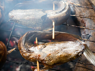 Picture of catfish that on a smoking process that make the taste more delicious