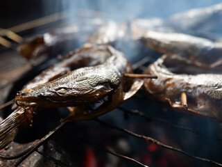 Picture of catfish that on a smoking process that make the taste more delicious