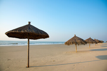 Recreational sunshade grass umbrella on the beach
