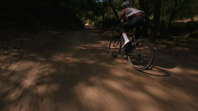 Gravel ride at forest Trail Path chasing drone shoot