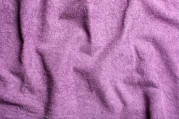 Fototapeta na wymiar Purple towel cloth background. Copy space