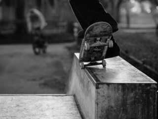 Skateboard grind closeup Black and white