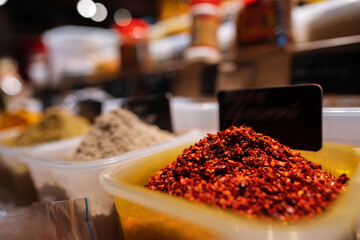 Colorful spices at a market for sale, close up