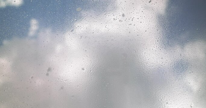 Window cleaner cleans window with foam and puller