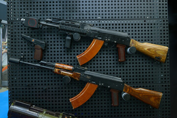 Assault rifles put on stand, gun shop - obrazy, fototapety, plakaty