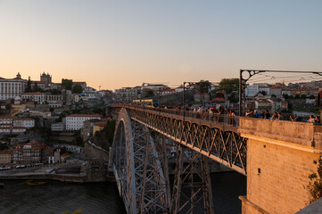Fototapeta premium People on the Bridge over the Douro Luis II River in Porto, Portugal in Summer 2022.
