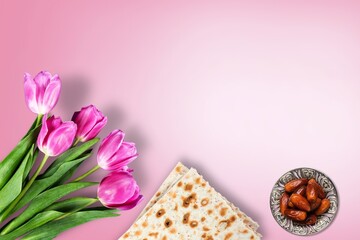 Jewish holiday Passover concept with matzah, nuts, flowers. Seder Pesach spring holiday background
