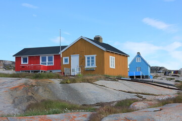 Fototapeta na wymiar Colourful houses in remote arctic settlement Rodebay (horizontal), Oqaatsut, Greenland