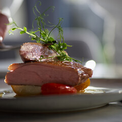Duck breast with pears in orange-ginger sauce.