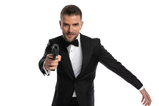 secret agent pointing his gun at the target