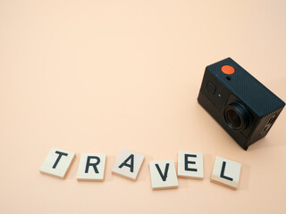 Inscription (Travel) in wooden letters, vacation and travel concept.