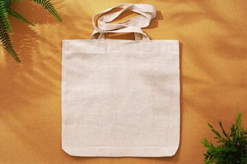 Textile shopping bag on beige background flat lay