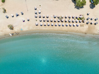 Aerial top view of the turquoise colored sea at Galissas beach, Syros island, Cyclades, Greece