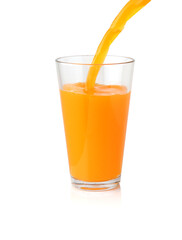 Orange juice pouring into the clear glass isolated on white background