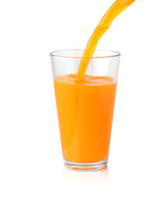 Orange juice pouring into the clear glass isolated on white background