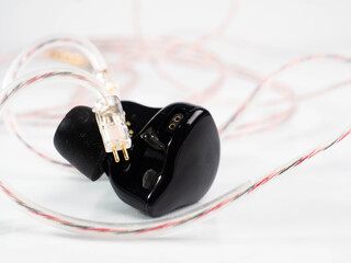 Pictures of a pair of black wired earphone