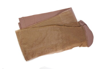 Women's nylon tights body color isolated on white background. Women's nylon stockings beige color. 