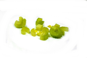 heap of sliced celery, isolated on white background 