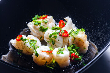 marinated sepia with parsley and chilli pepper filled with rice