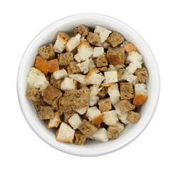 Bread croutons on a white background. Scattered pile of homemade rye bread croutons isolated on white background top view. Crispy bread cubes, dry rye crumbs, rusks, crouoton or brown roasted crackers