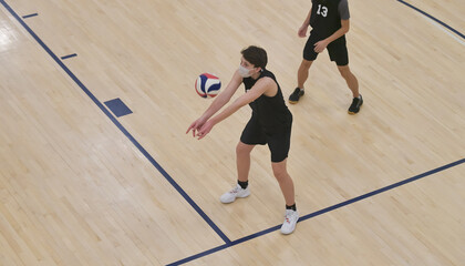 Masked outside hitter passing the ball