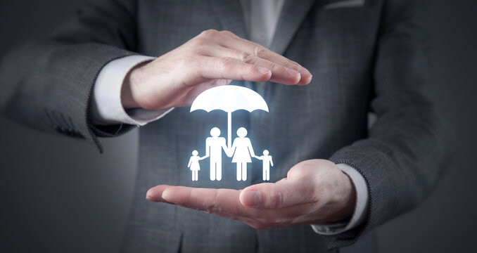 Man protect family symbol with a umbrella. Family insurance concept