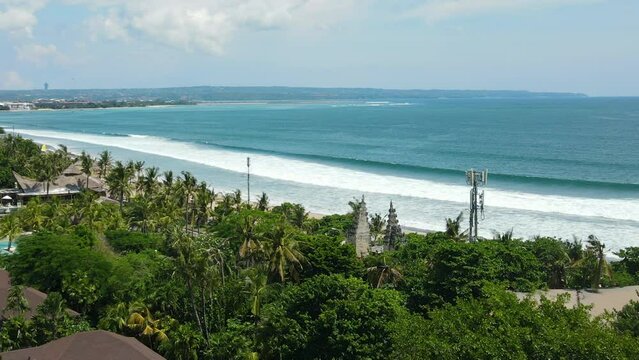 Aerial View of Legian Beach, Kuta, Bali Island, Indonesia. Gate, Green Tropical Lush and Turquoise Ocean Water, Drone Shot
