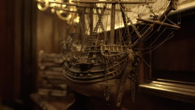 Antique ship of the line model in old library.