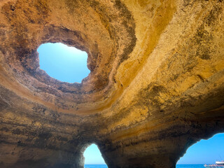 View of rough rocky formation near ocean