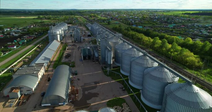 Storage facility for soy and wheat grains. Harvesting. Grain elevator aerial view. A tank for wheat grain. Grain storage facilities.
