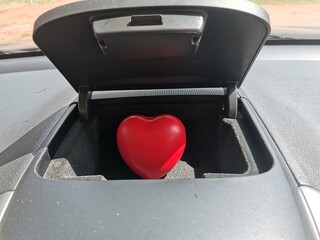 red heart in the car compartment