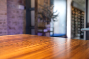 Wooden table in the room with blurred background