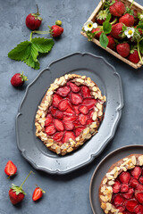 Galette with strawberries. Summer light dessert. French pastry. Open sweet pie with berries.
