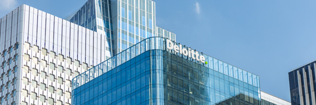Deloitte headquarters tower in La Defense business district in Paris, France