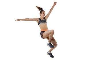 Fototapeta na wymiar Development of movements in long jump sport. One professional female athlete in sports uniform jumping isolated on white background.