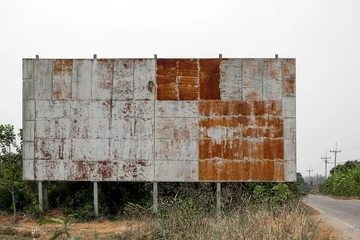  The old billboard is damaged. Old billboards. An antique sign on the roadside. View board  © As Tor 