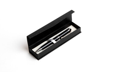 Pen in black box on a white background
