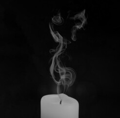 Candle with smoke in black and white