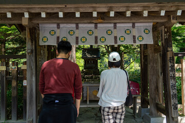 couple in front of a house