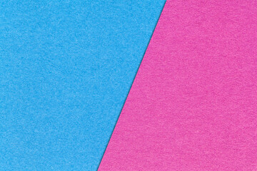 Fototapeta premium Texture of craft light blue and lilac paper background, half two colors, macro. Structure of magenta cardboard.