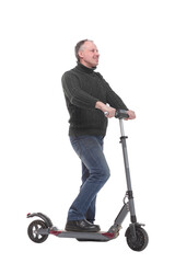 Side view of young modern man using and driving electric isolated over white background