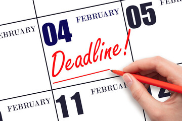 Hand drawing red line and writing the text Deadline on calendar date February 4. Deadline word written on calendar